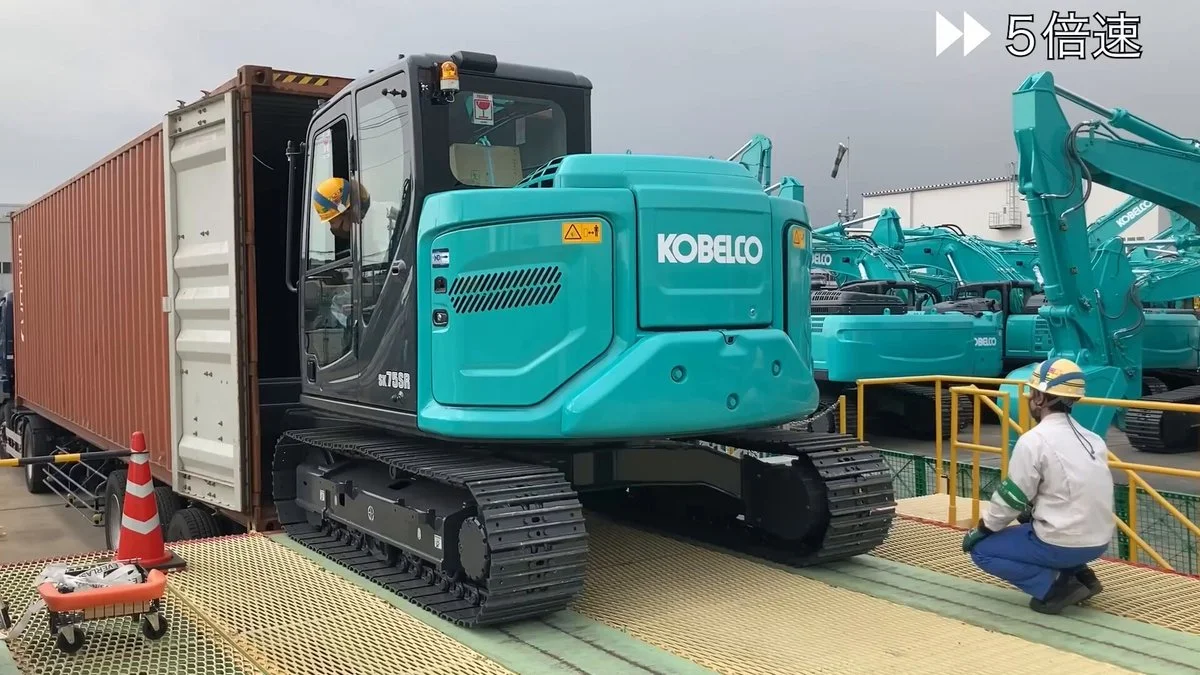 An Excavator Fits Its Shipping Container Perfectly. So How Does the Driver Get Out?
